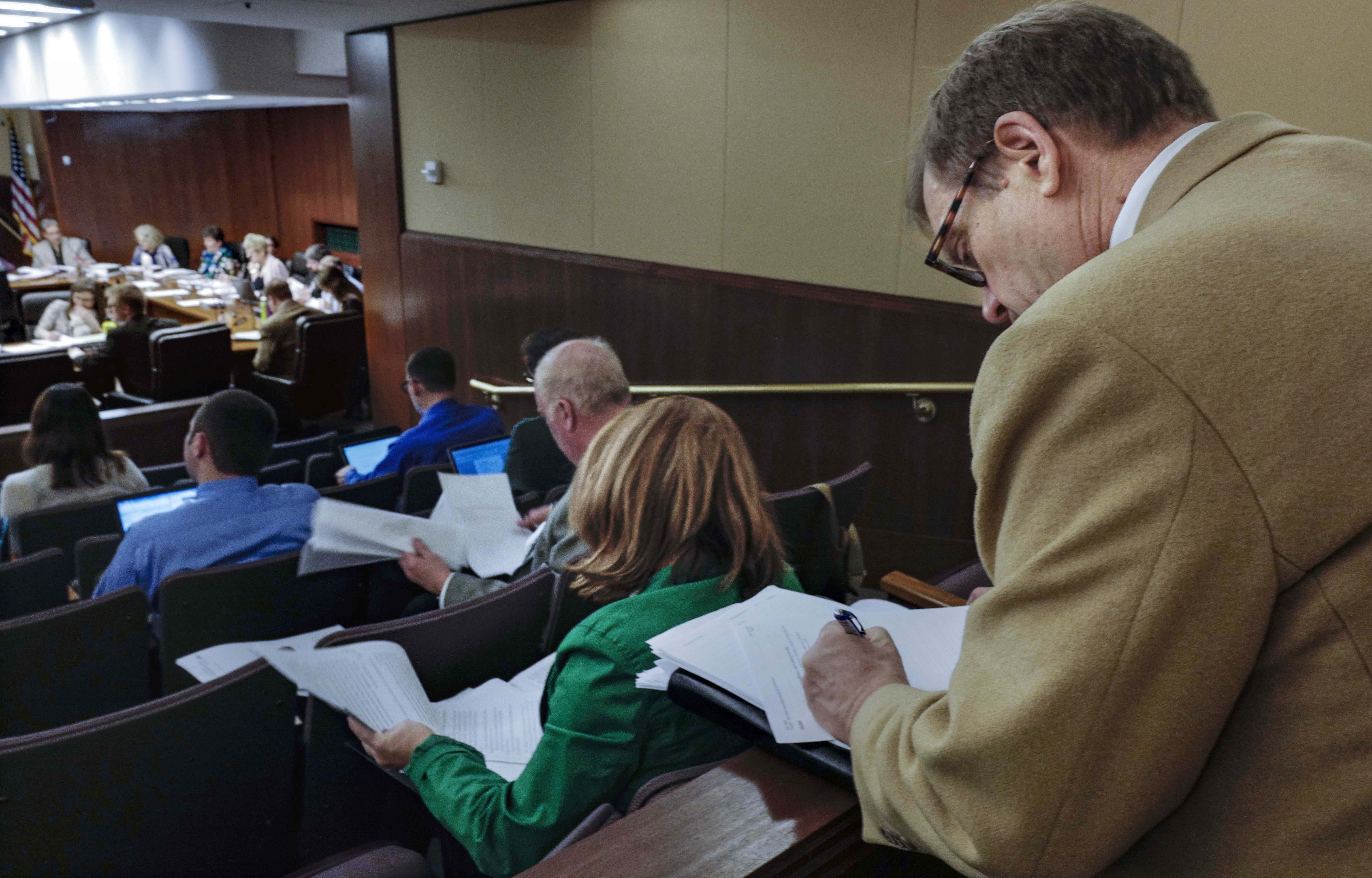 Brad Lundell, executive director of Schools for Equity in Education, takes notes Thursday as the House Education Innovation Policy Committee begins to markup HF3066, the omnibus education policy bill. Photo by Tom Olmscheid